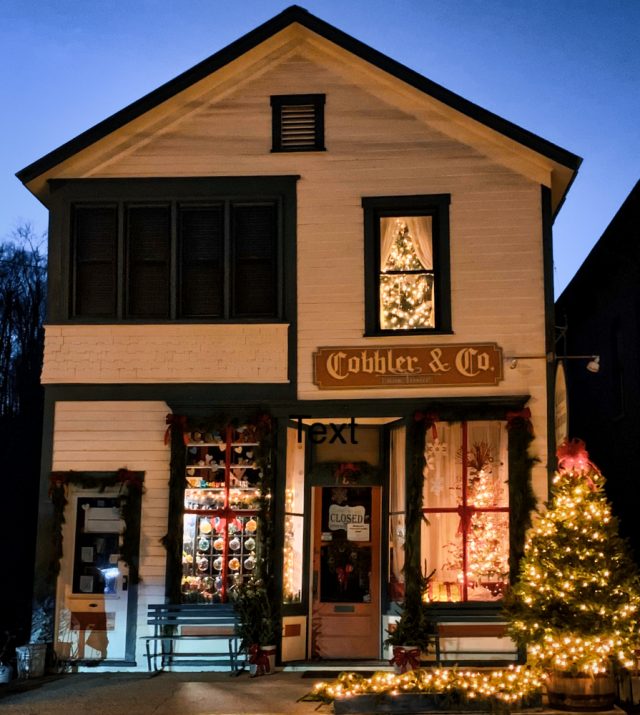 Cobbler & Co storefront during winter holidays